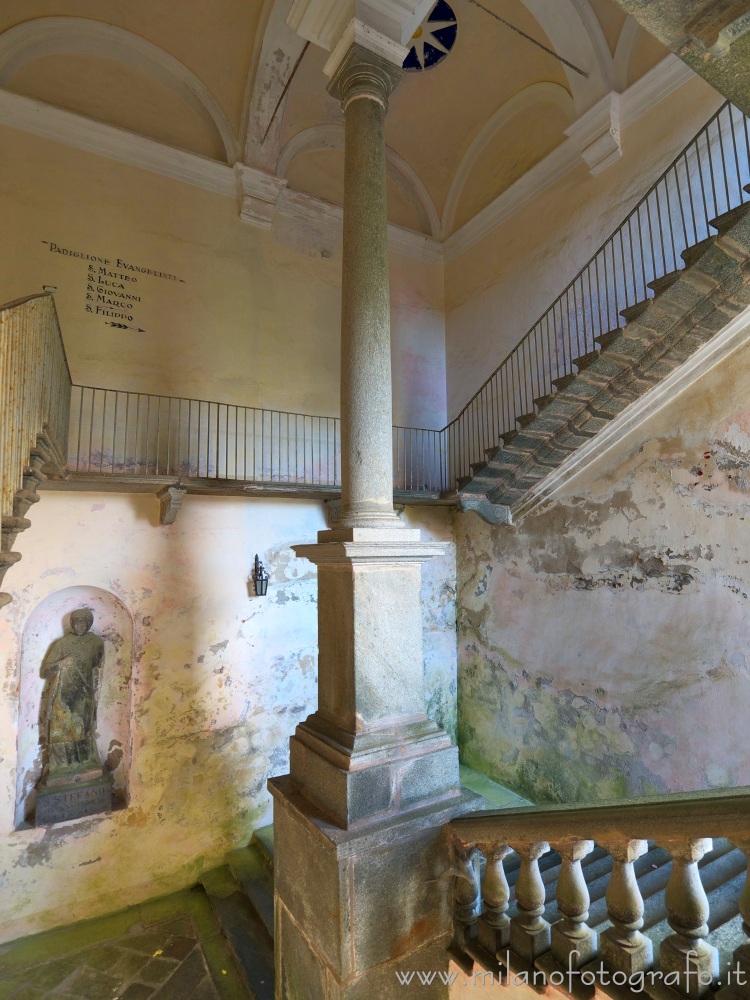 Biella (Italy) - Stairway in the upper courtyard of the Sanctuary of Oropa with the mysterious statue of Saint Stephen